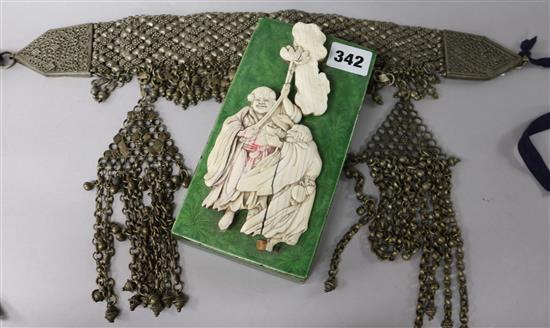 A white metal headdress and an ivory mounted green enamel box.